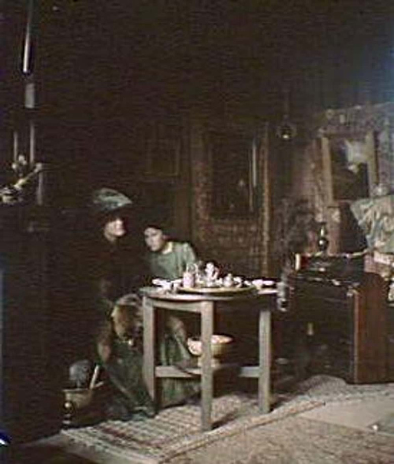 Two Women Dressed In Green Sitting At A Table, c. 1906